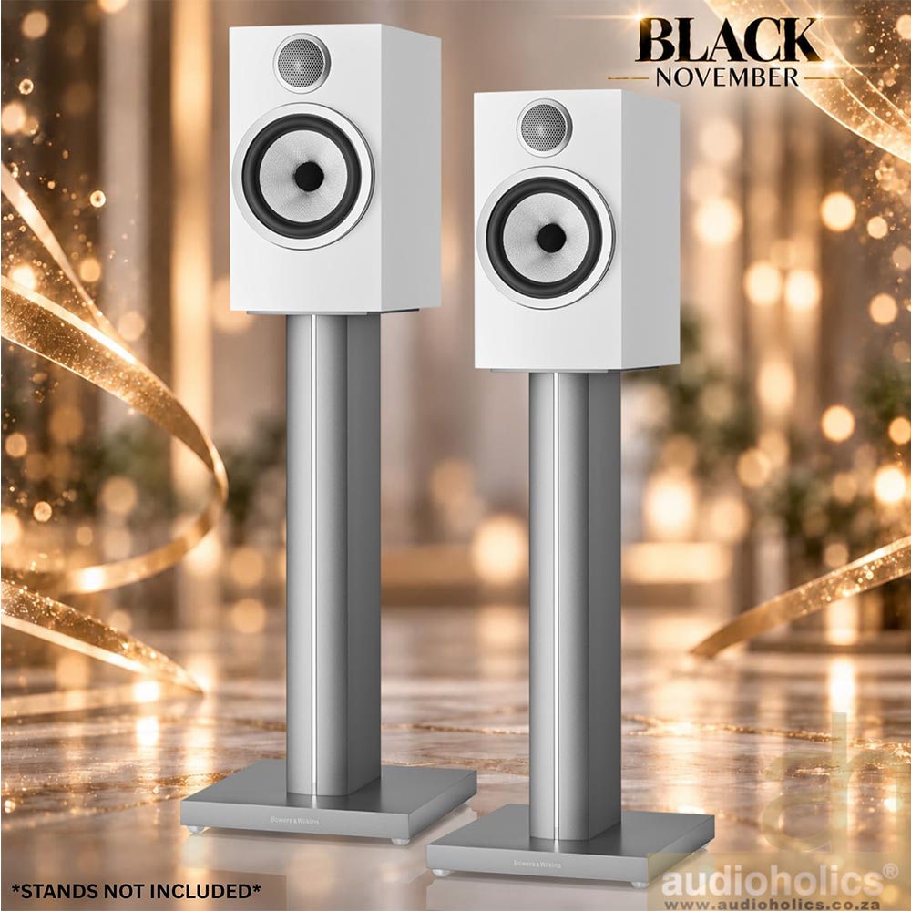 706-Main - Audioholics South Africa Two white speakers on tall silver stands in a festive showroom background with a Black November promotion.