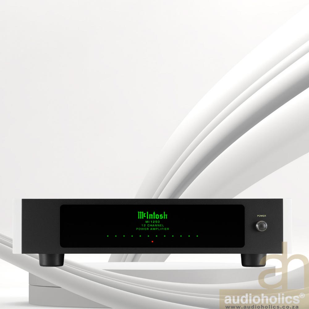 McIntosh-MI1250-Main - Audioholics South Africa Front view of a McIntosh power amplifier with a black faceplate and green status display on a white surface, with cables looping in the background and logo visible in green letters on the display.