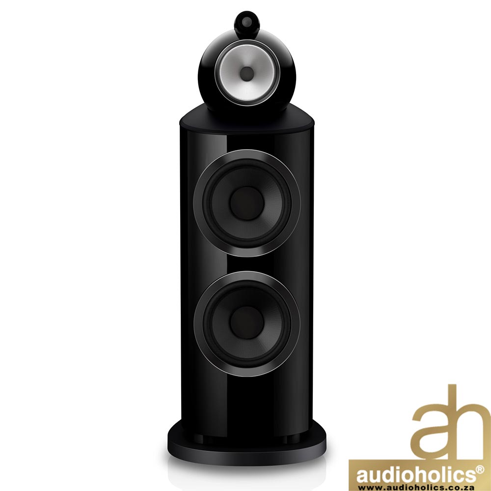 Glossy black floor-standing speaker with three large drivers and a small top tweeter; Audioholics watermark bottom right.