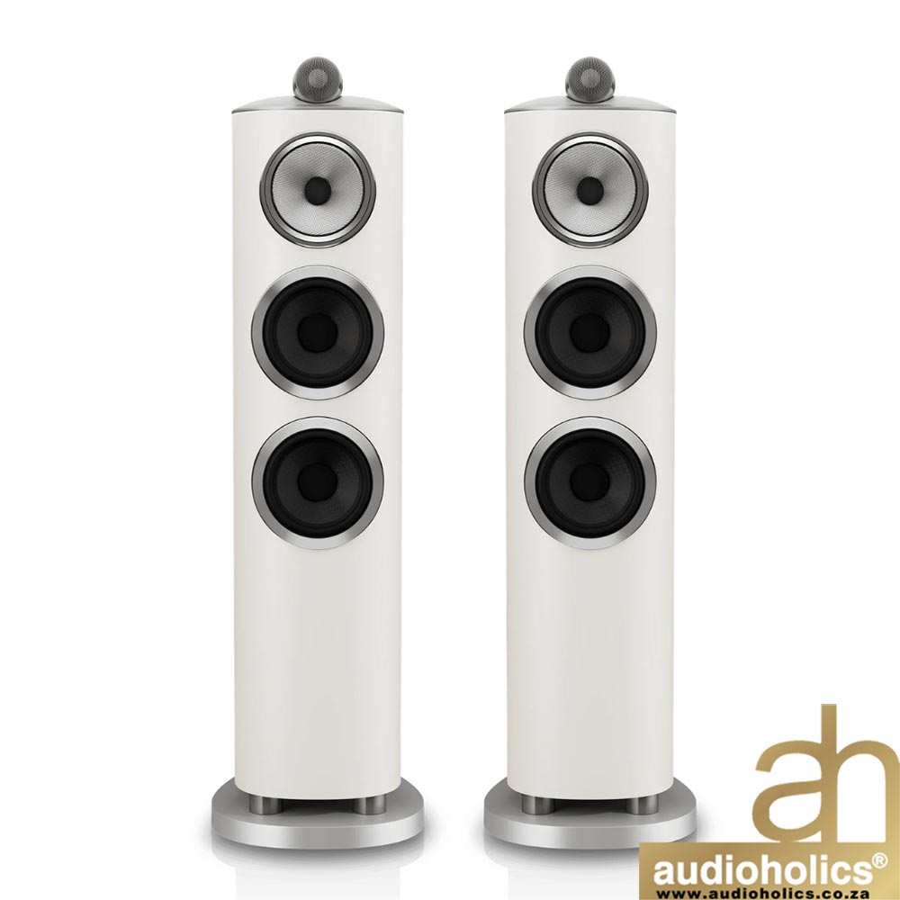 BW-804-D5-Galleryjpg-4 - Audioholics South Africa Pair of white floor-standing speakers with three drivers each, on metal bases, seen with Audioholics logo in corner.