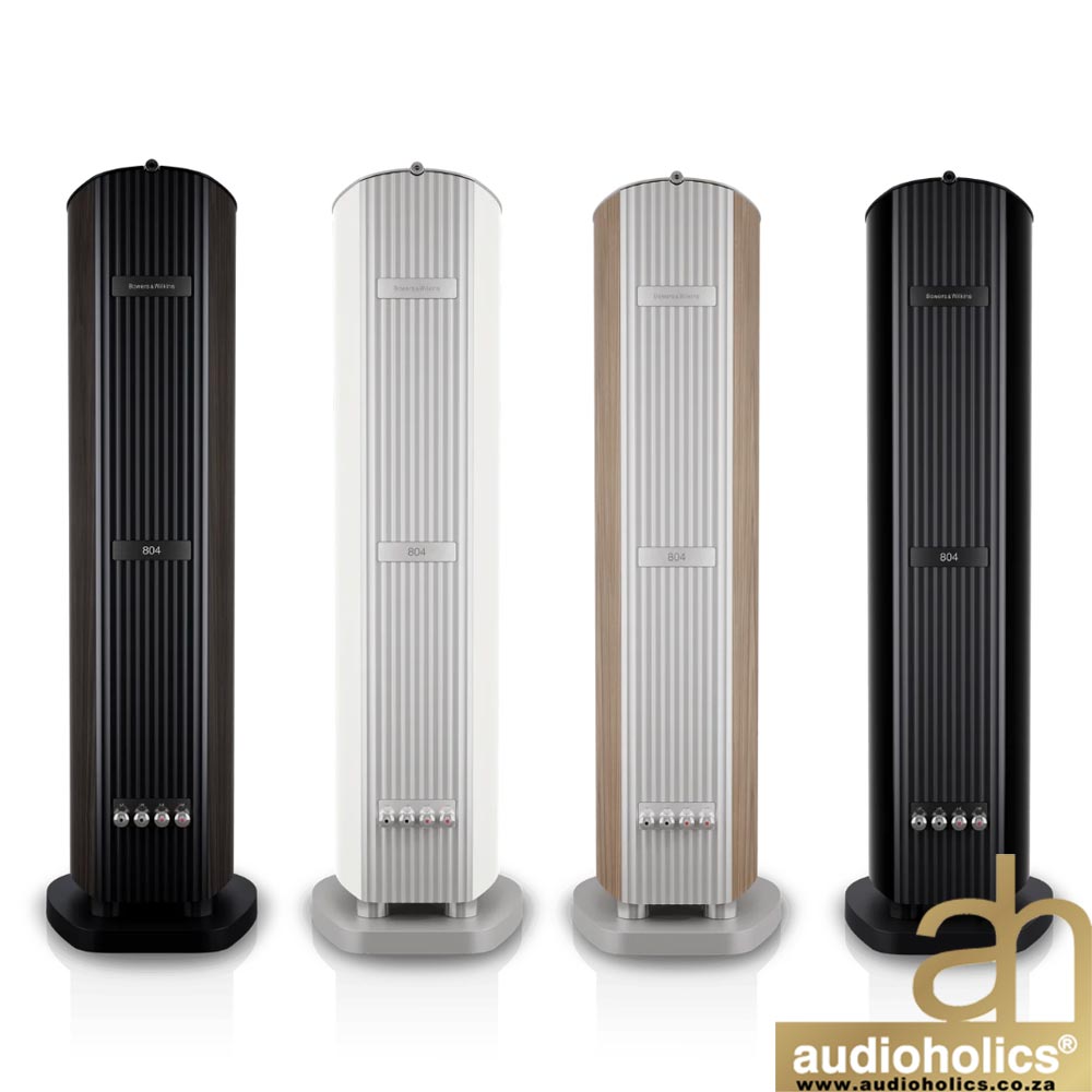 BW-804-D5-Galleryjpg-5 - Audioholics South Africa Four tall floor-standing speakers in black, white, wood, and black finishes lined up, with an Audioholics watermark in the corner.