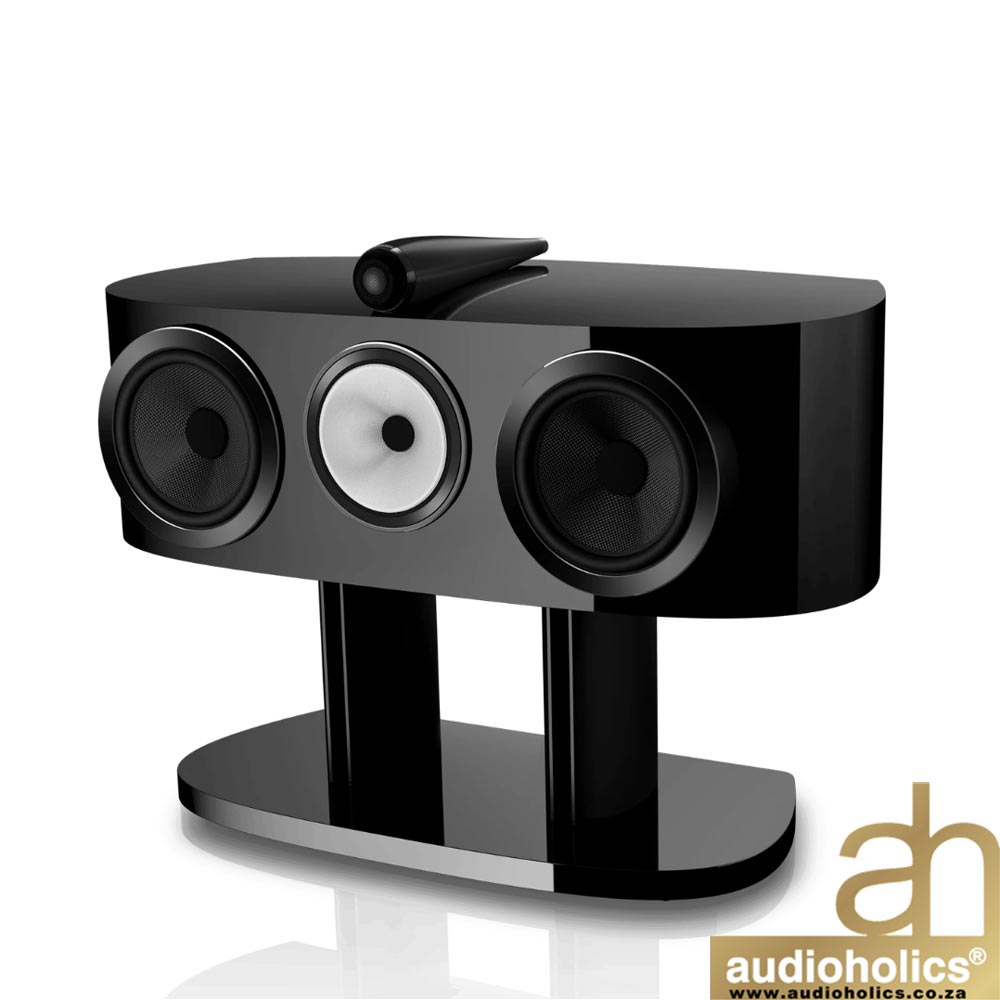 Black three-driver speaker on a glossy black stand, with Audioholics logo watermark.