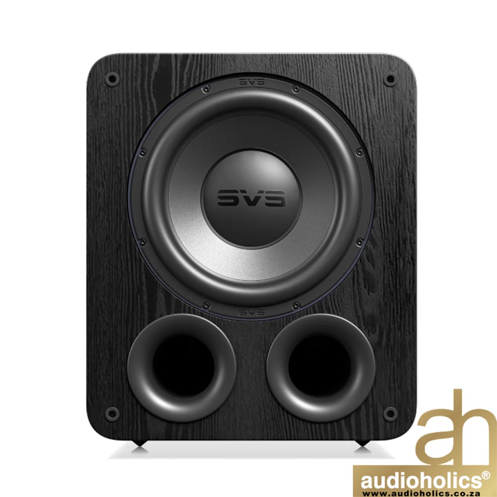 Wood-textured black speaker with a large central woofer and two bottom port openings; Audioholics logo in the corner.