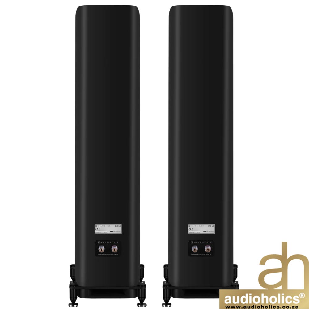 Pair of black floor-standing speakers on small stands, shown from the rear with binding posts visible.