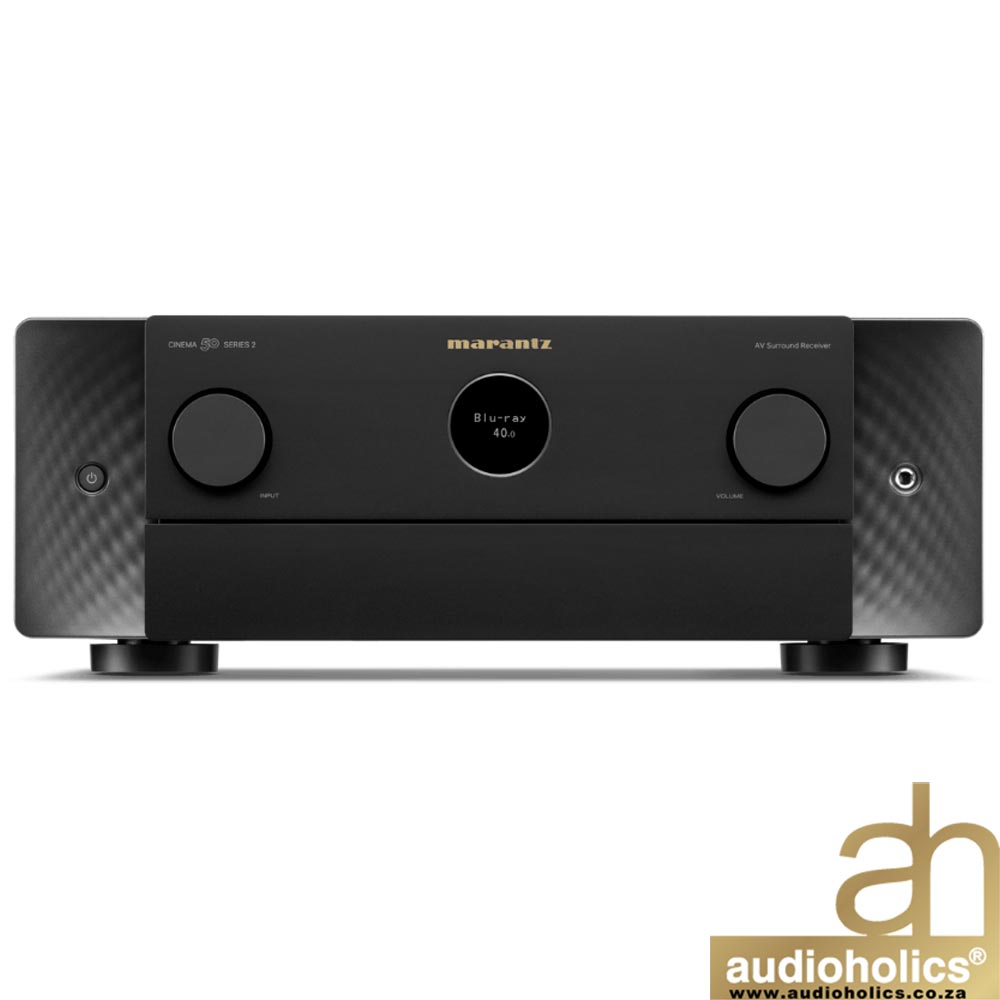 Marantz AV surround receiver front panel with two large knobs and a center display showing Blu-ray 4.0, plus an Audioholics logo in the bottom-right corner.