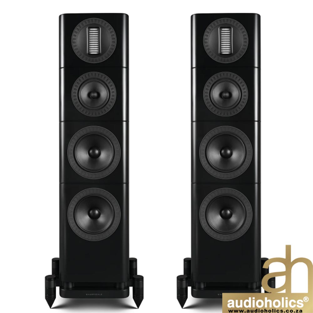 Pair of black floor-standing loudspeakers with multiple drivers, shown in a stereo setup.